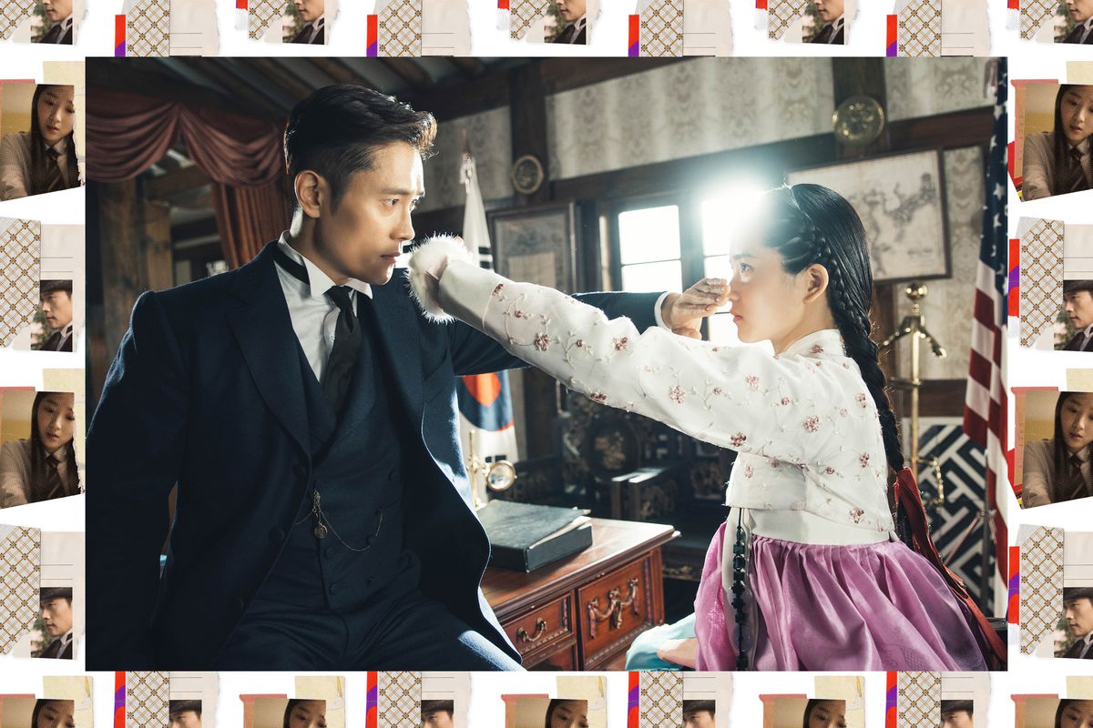 Lee Byung-hun and Kim Tae-ri hold their hands in each other’s faces in Mr. Sunshine.