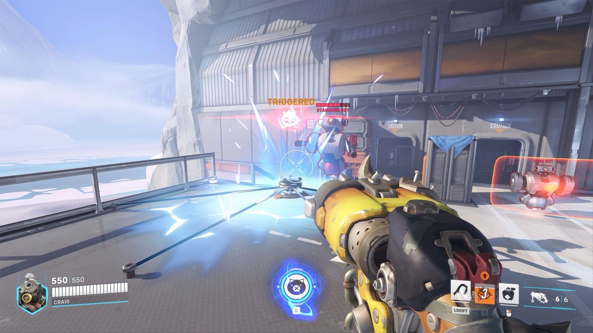 Roadhog’s Pig Pen trap activates, shocking a Training Bot, in a screenshot from Overwatch 2