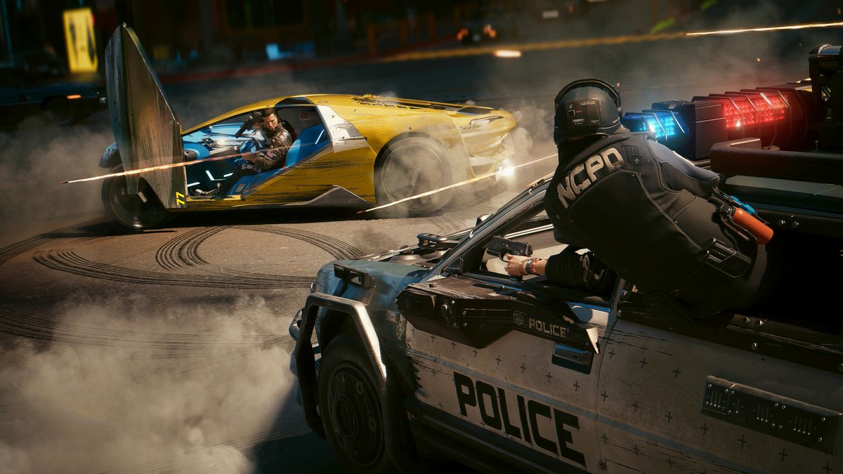V, the player character in Cyberpunk 2077, driving away from a police car in pursuit while firing a weapon in Cyberpunk 2077.