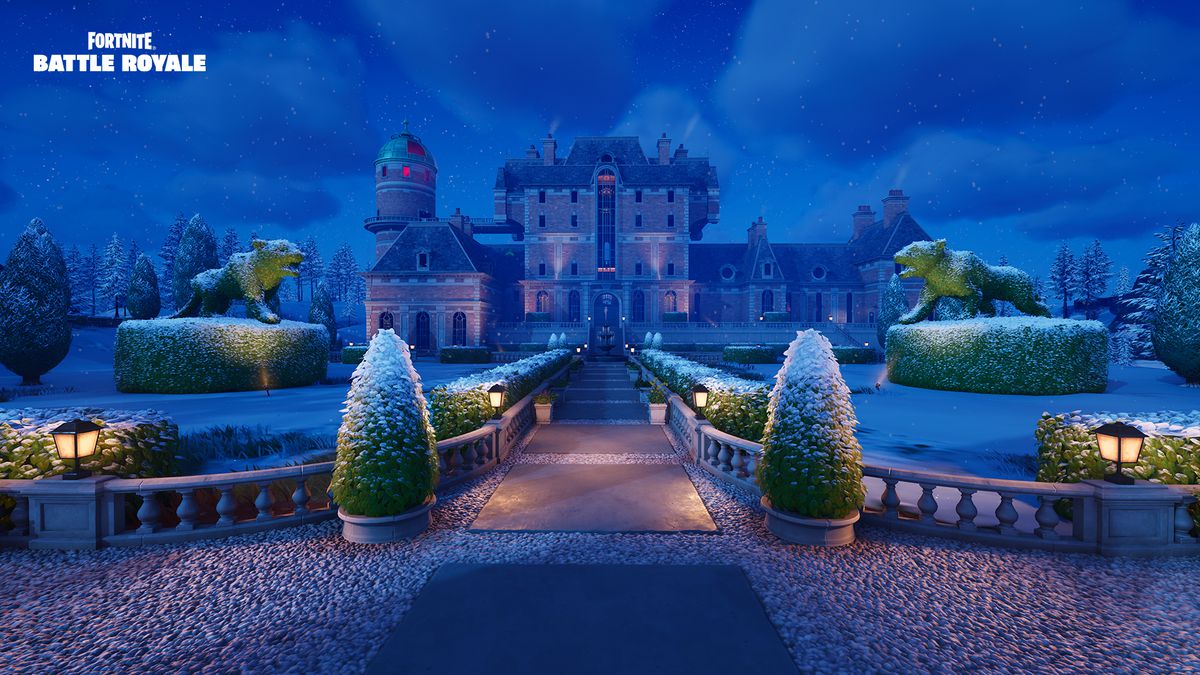 A sweeping manor in Fortnite. It’s lined with manicured hedges and a stone walkway.