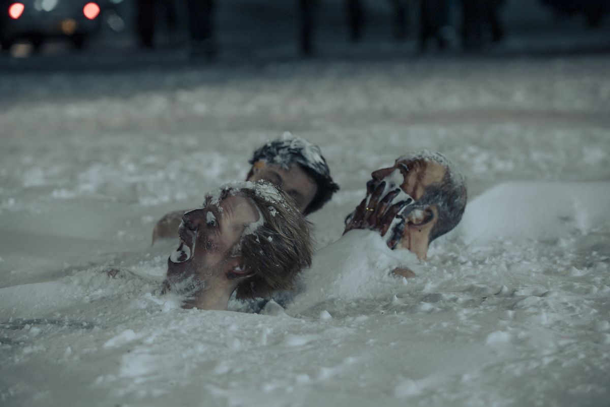 A trio of frozen heads buried in the snow in True Detective: Night Country.