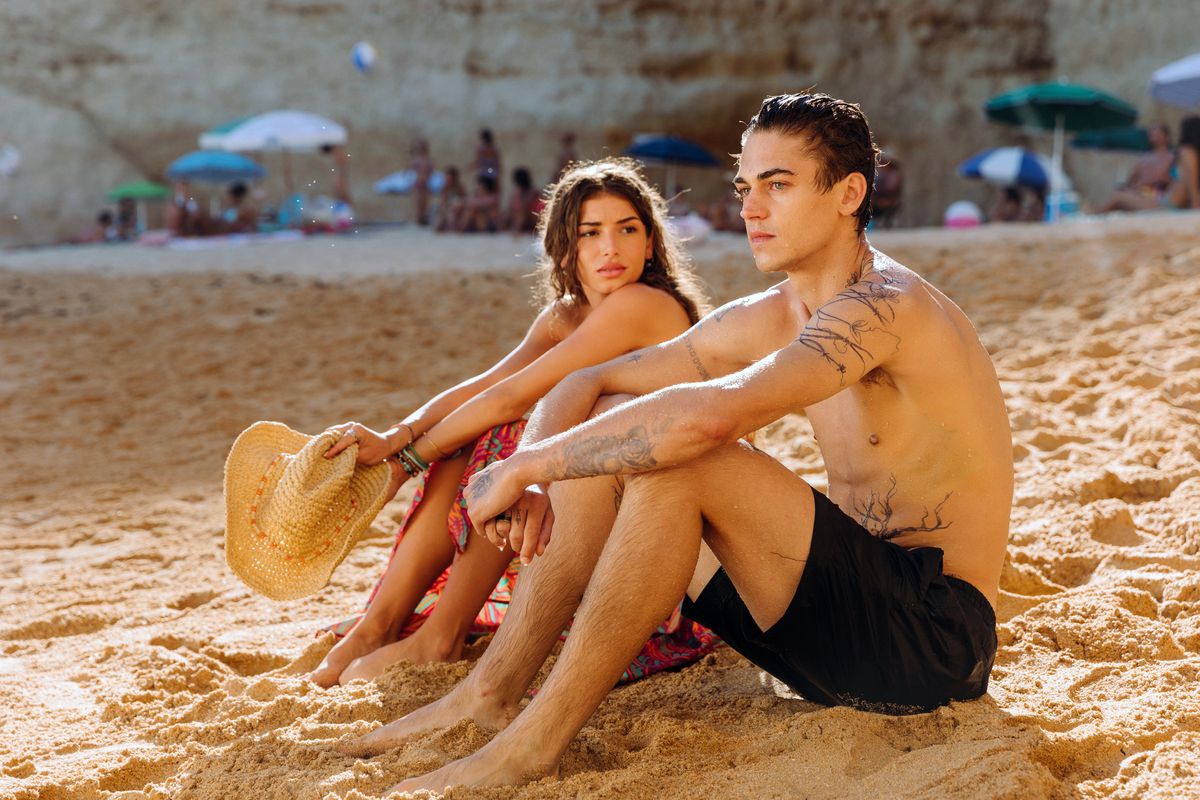 (L-R) Mimi Keene and Hero Fiennes Tiffin sitting on a beach in After Everything.
