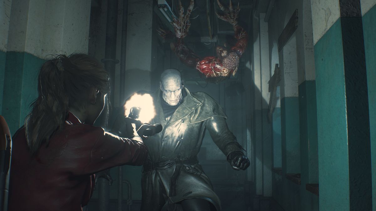Claire Redfield fires her pistol at a flashlight-illuminated Tyrant while a Licker scurries along the ceiling of the Raccoon City Police Department in a screenshot from Resident Evil 2 (remake)