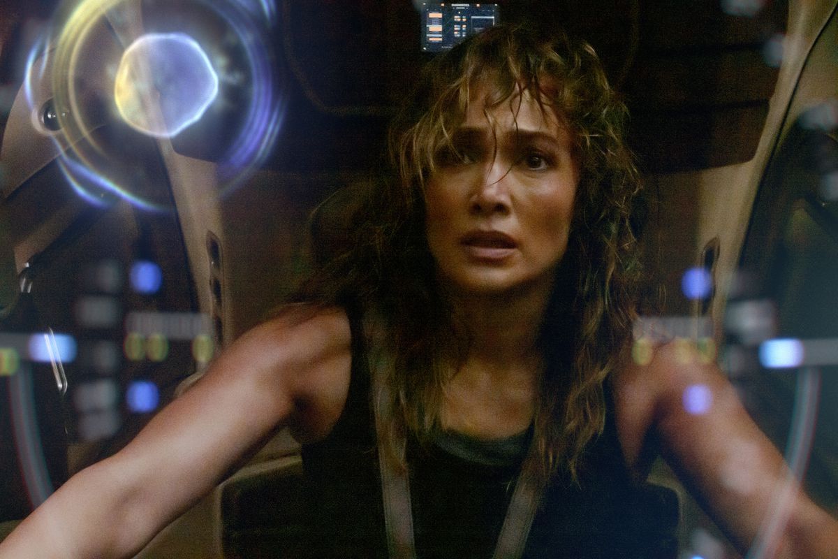 Jennifer Lopez looking disheveled as she pilots some big sci-fi contraption 