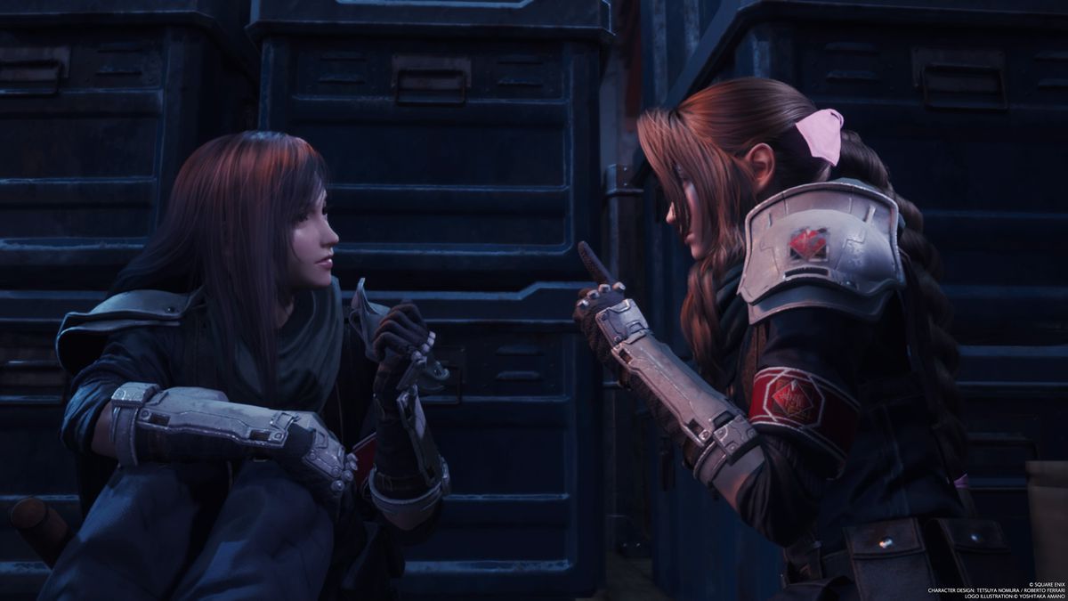 An image showing Tifa and Aerith having a private conversation in Final Fantasy 7 Rebirth. They’re in a dark room and leaning in to talk to each other. 