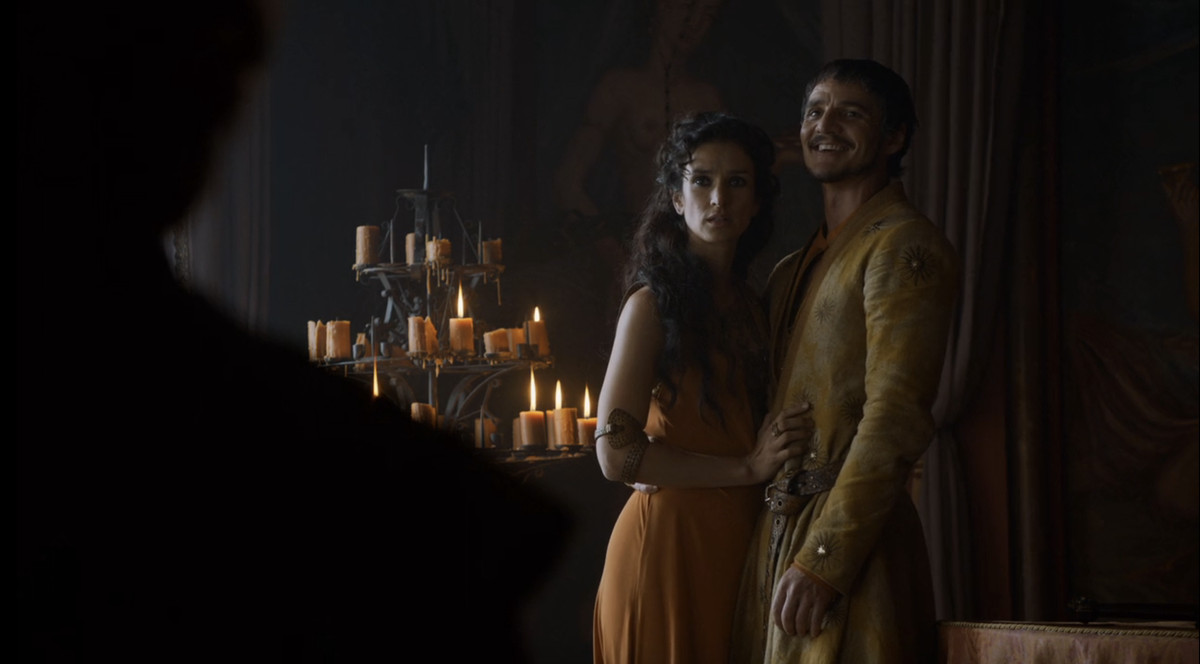Oberyn (Pedro Pascal) laughing as he holds Ellaria in Game of Thrones