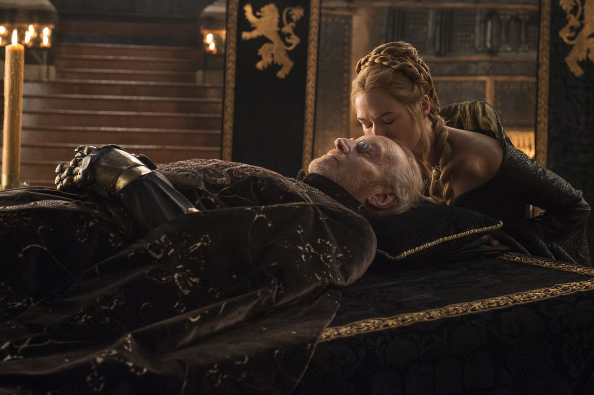 Cersei (Lena Hadley) kissing the forehead of her father’s body 