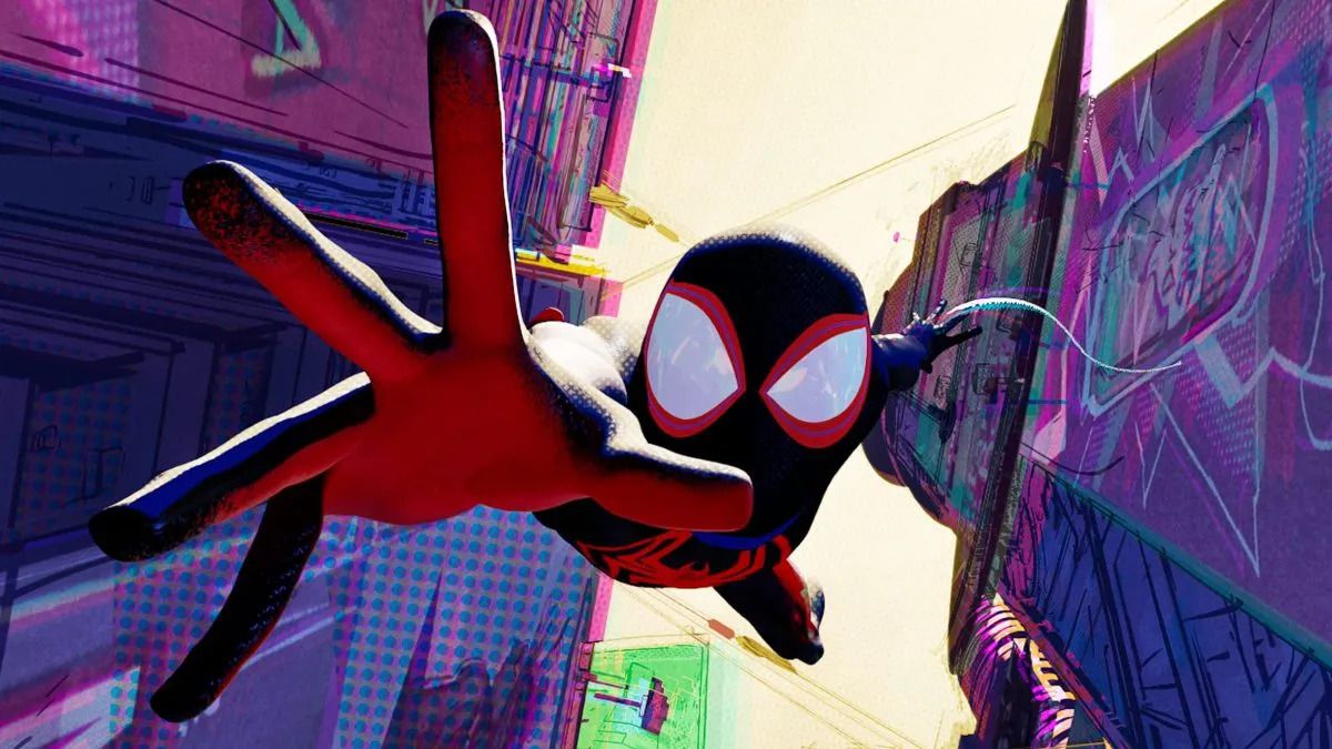 Spider-Man extending his hand as he falls from a great height, surrounded by skyscrapers in Spider-Man: Across the Spider-Verse.