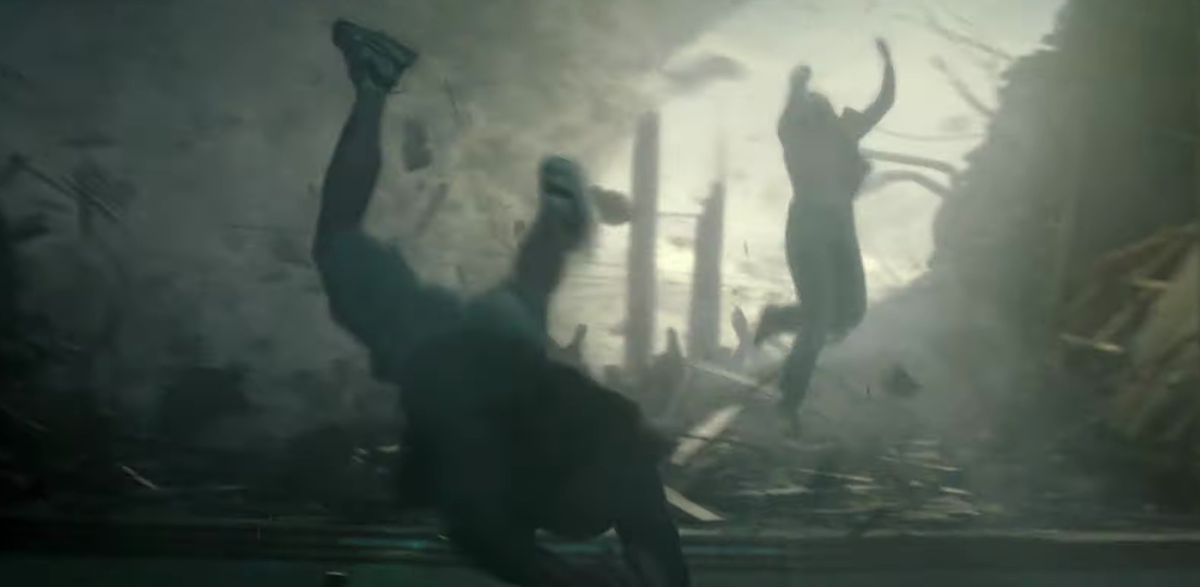 People and debris fly through the air in Twisters.