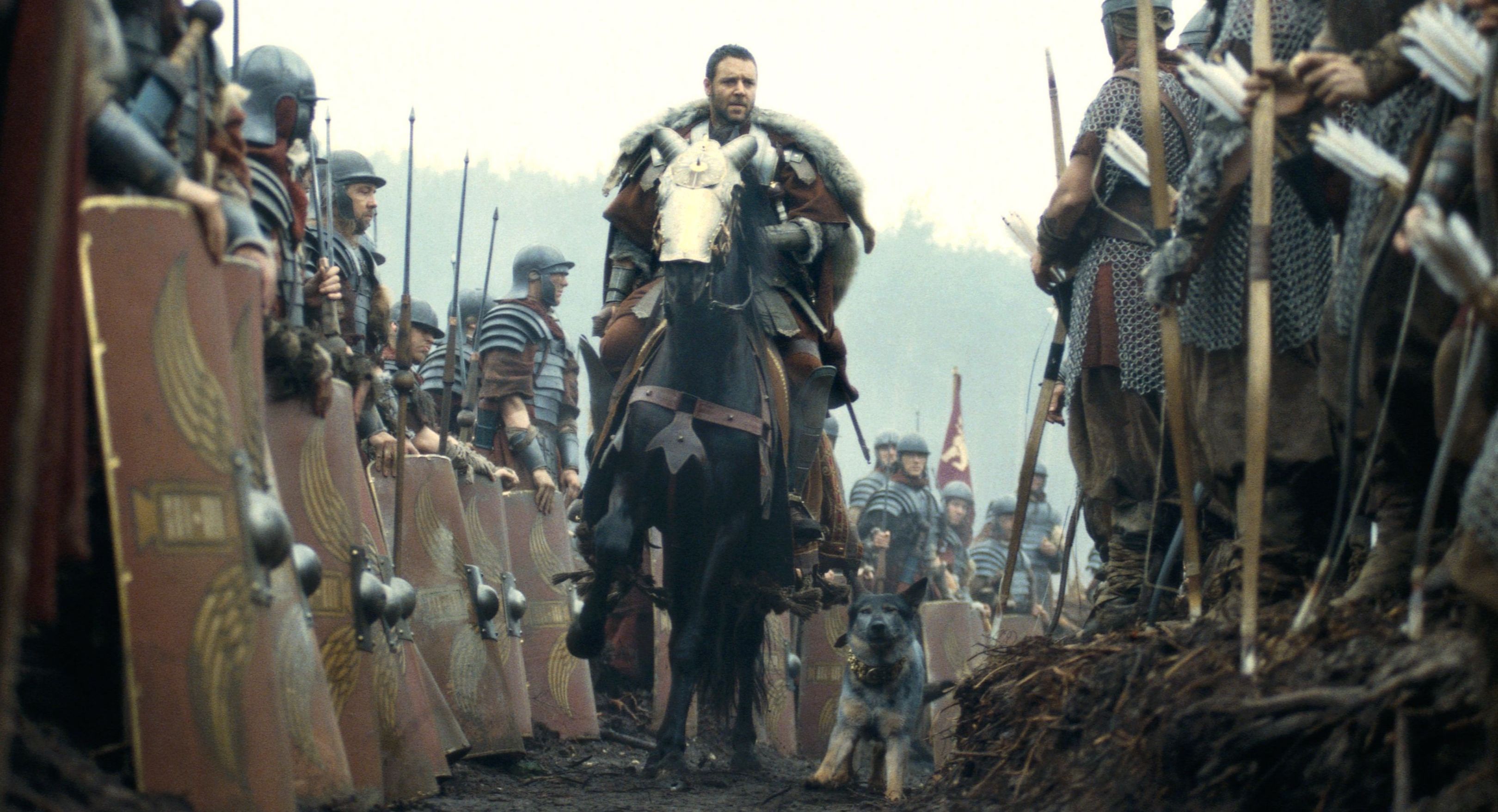 Gladiator Maximus (Russell Crowe) rides on horseback through an army of Roman soldiers in 2000’s Gladiator