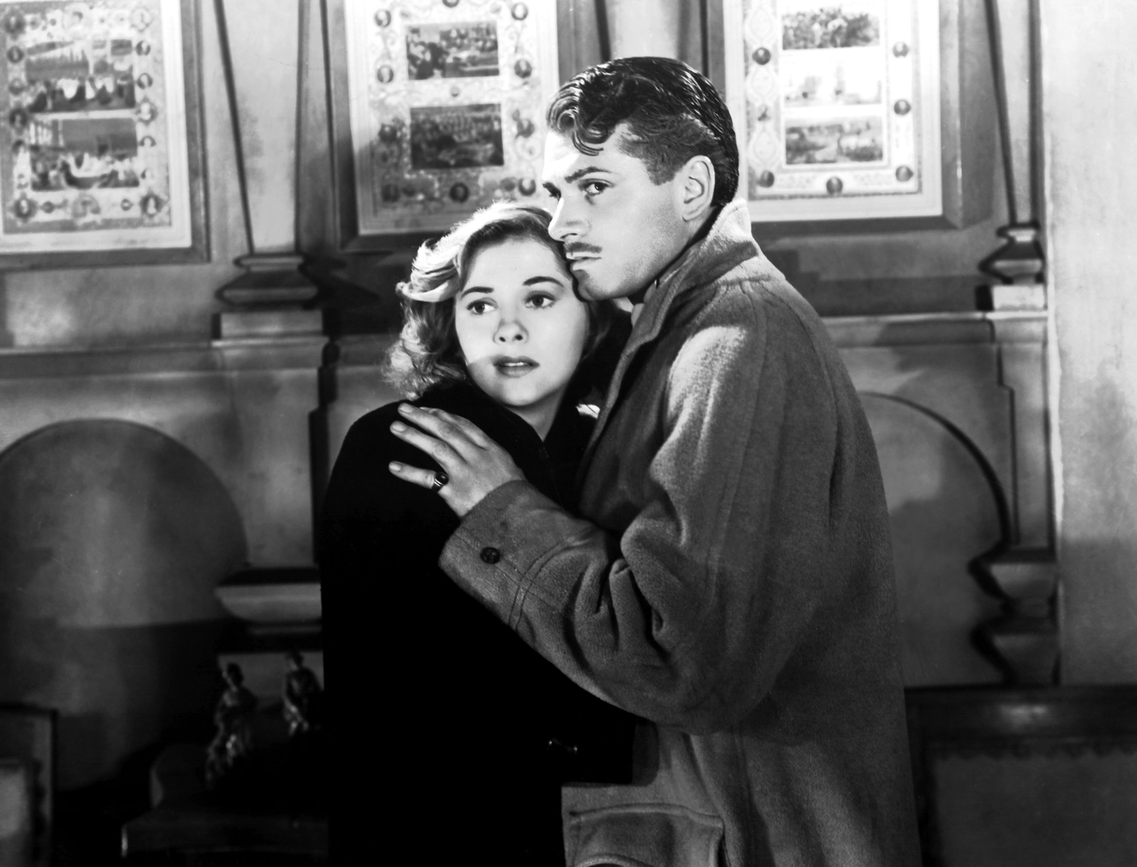 In Rebecca, Joan Fontaine and Laurence Olivier embrace, scared