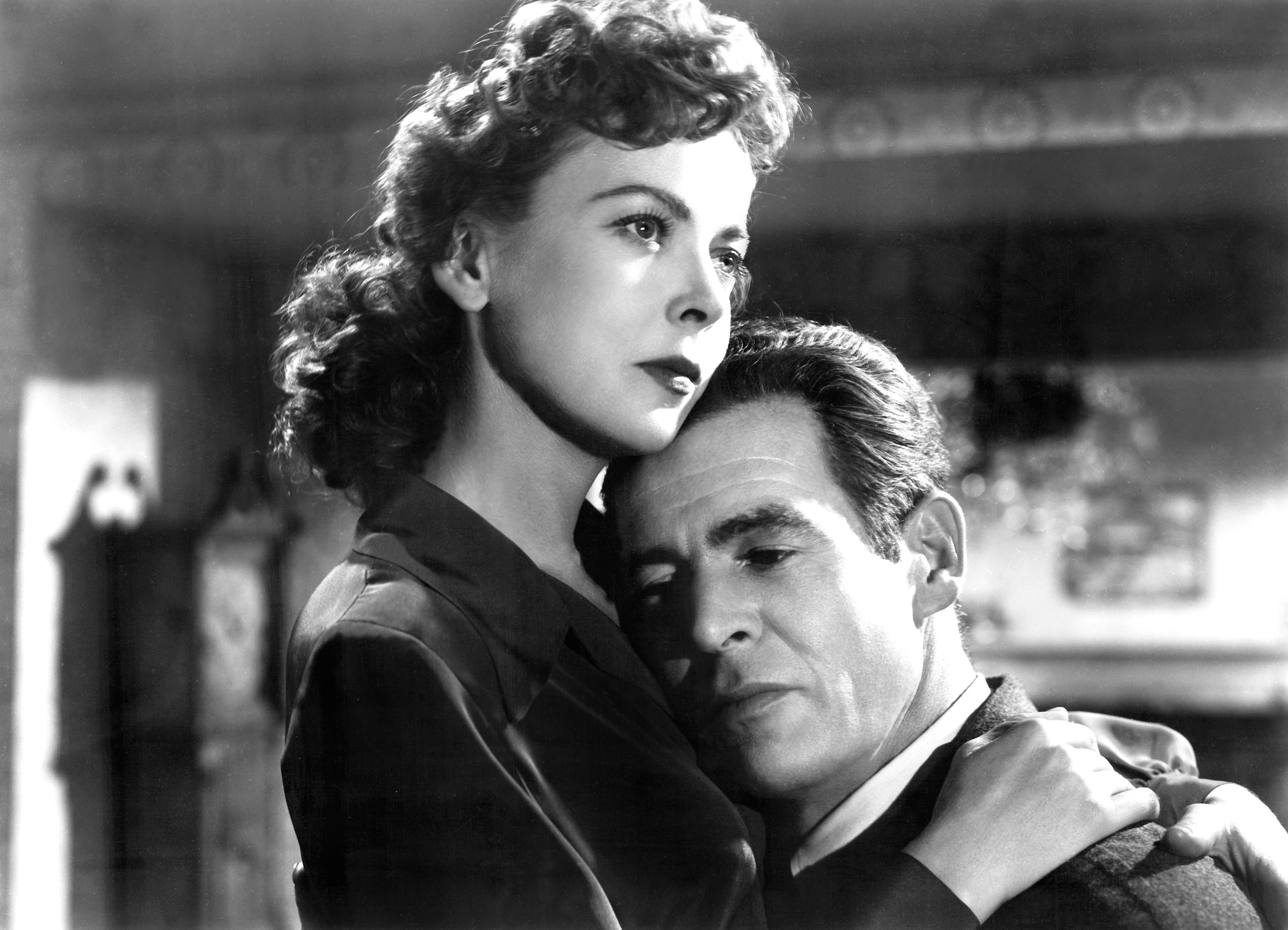 Ida Lupino embraces Robert Ryan, with melancholy in both of their eyes, in On Dangerous Ground