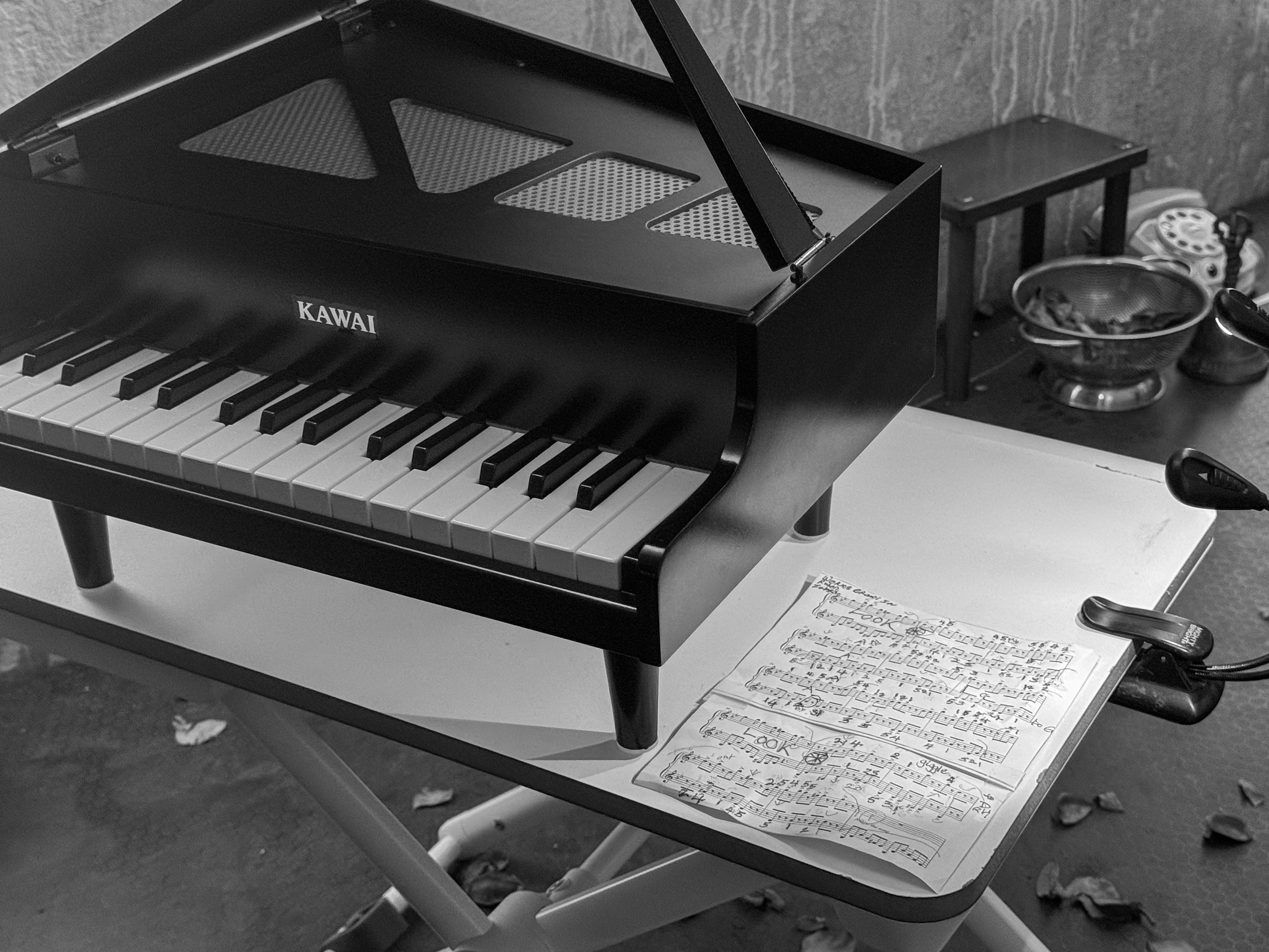 A toy piano and sheet music from the October 3, 2024 performance of Curios in the Catacombs by Margaret Leng Tan at Green-Wood Cemetery in New York