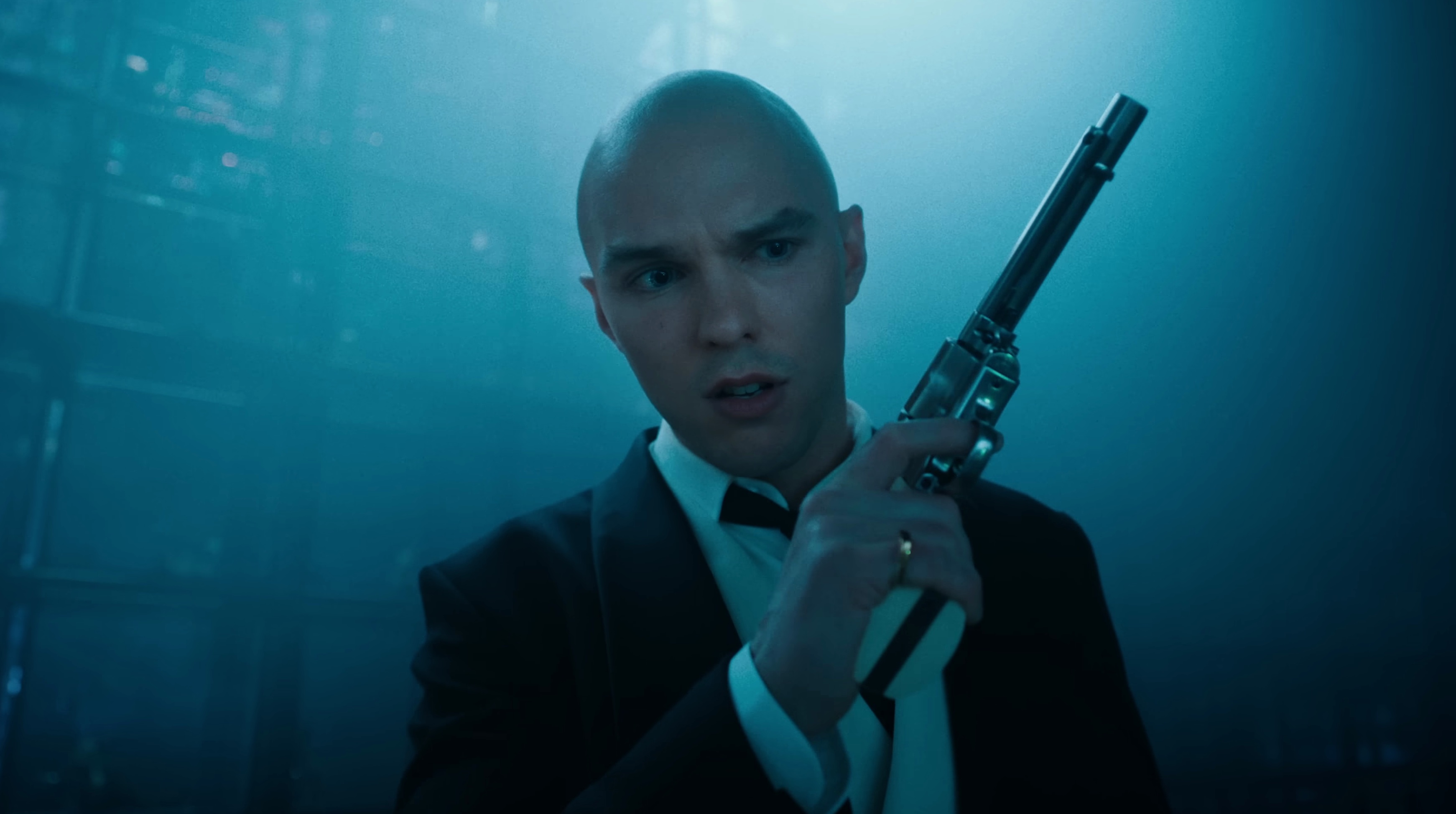 Nicholas Hoult holding a gun as Lex Luthor in Superman 2025