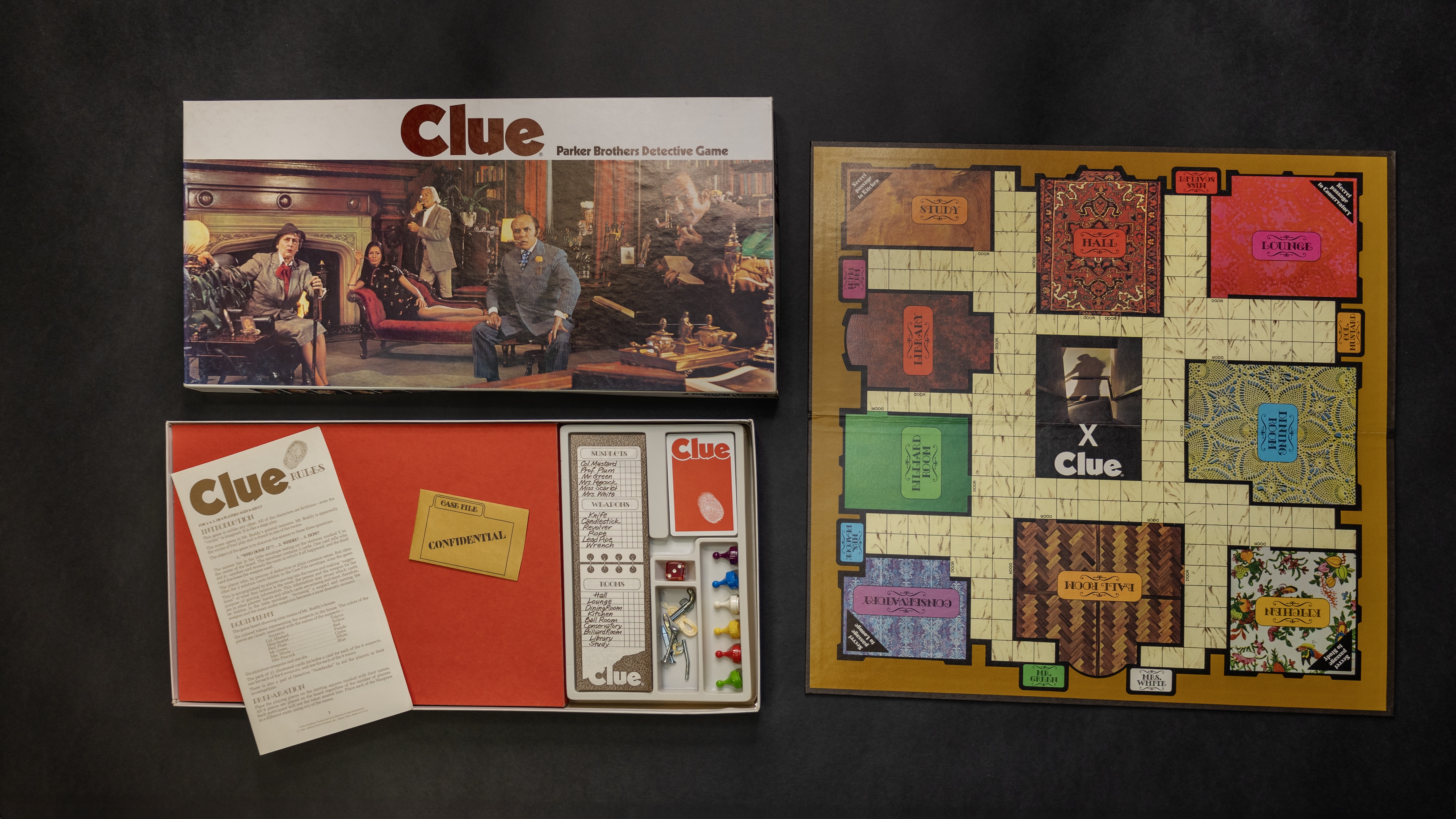 The 1972 edition of Clue, including the board, box, and accessories.