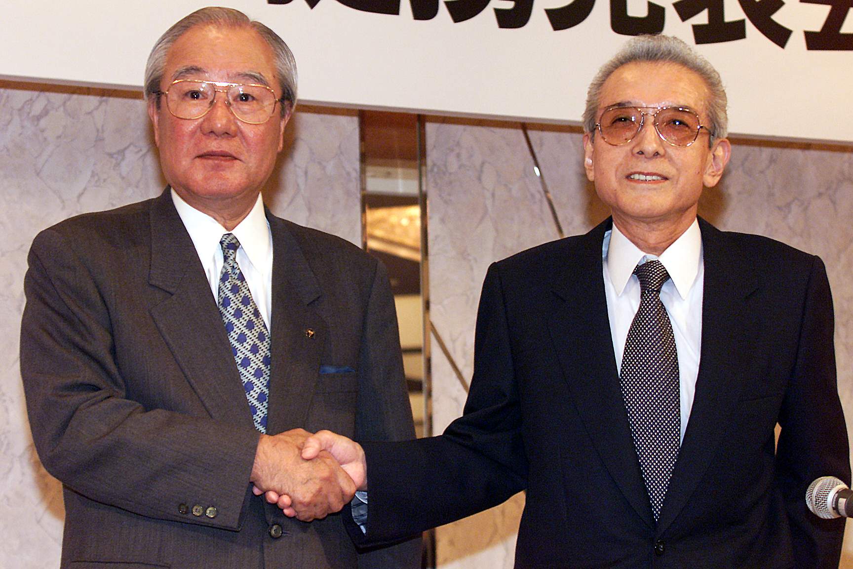 Former Nintendo president Hiroshi Yamauchi with Matsushita president Yocihi Morishita