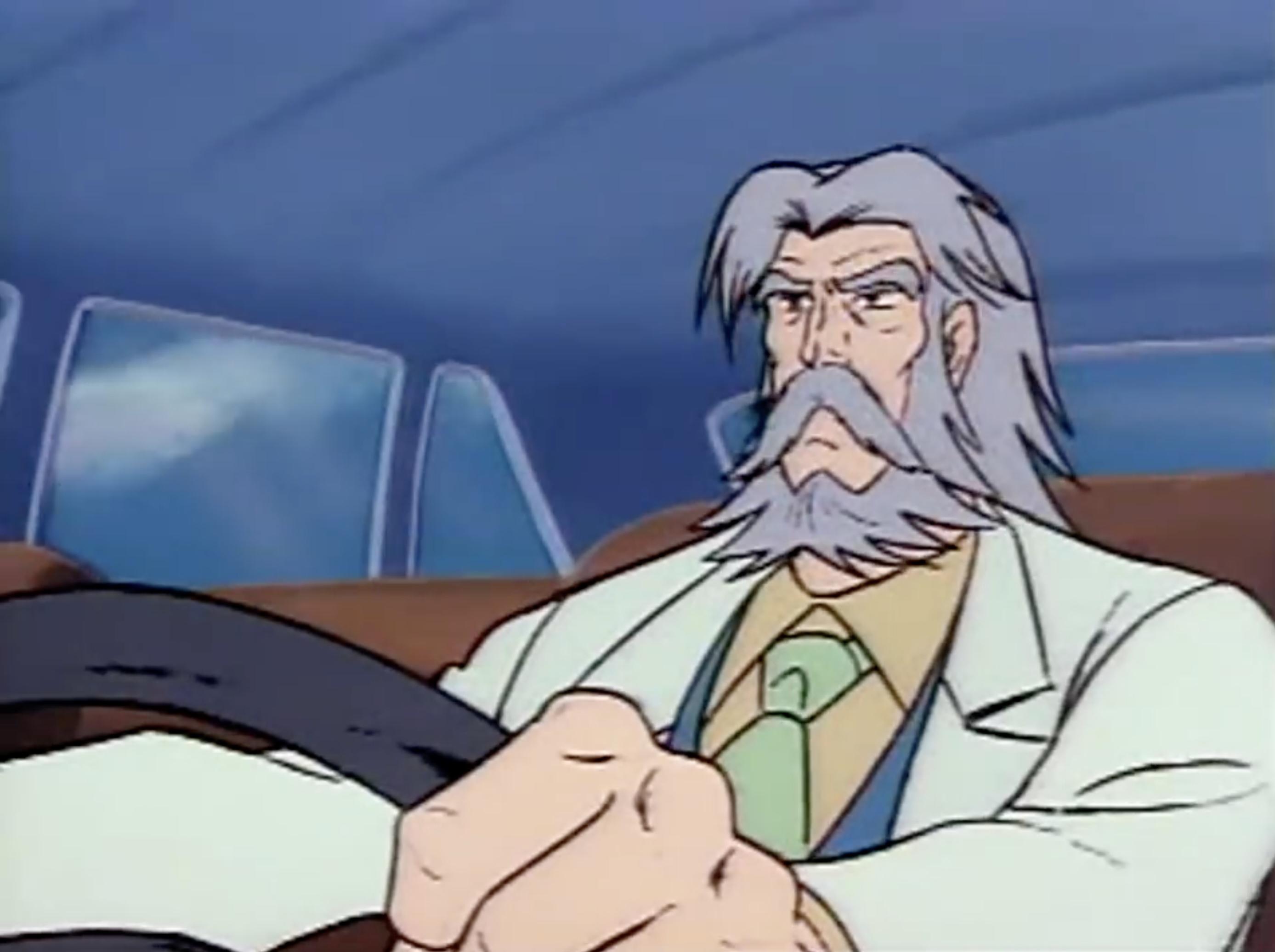 A screenshot from Voltes V shows an old man driving a car