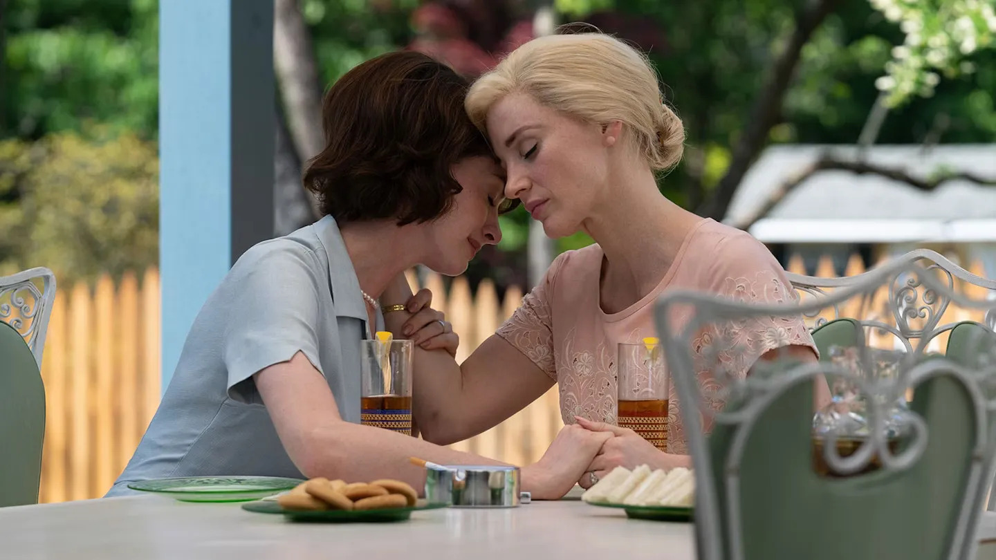 Anne Hathaway and Jessica Chastain leaning close to one another in Mothers’ Instinct