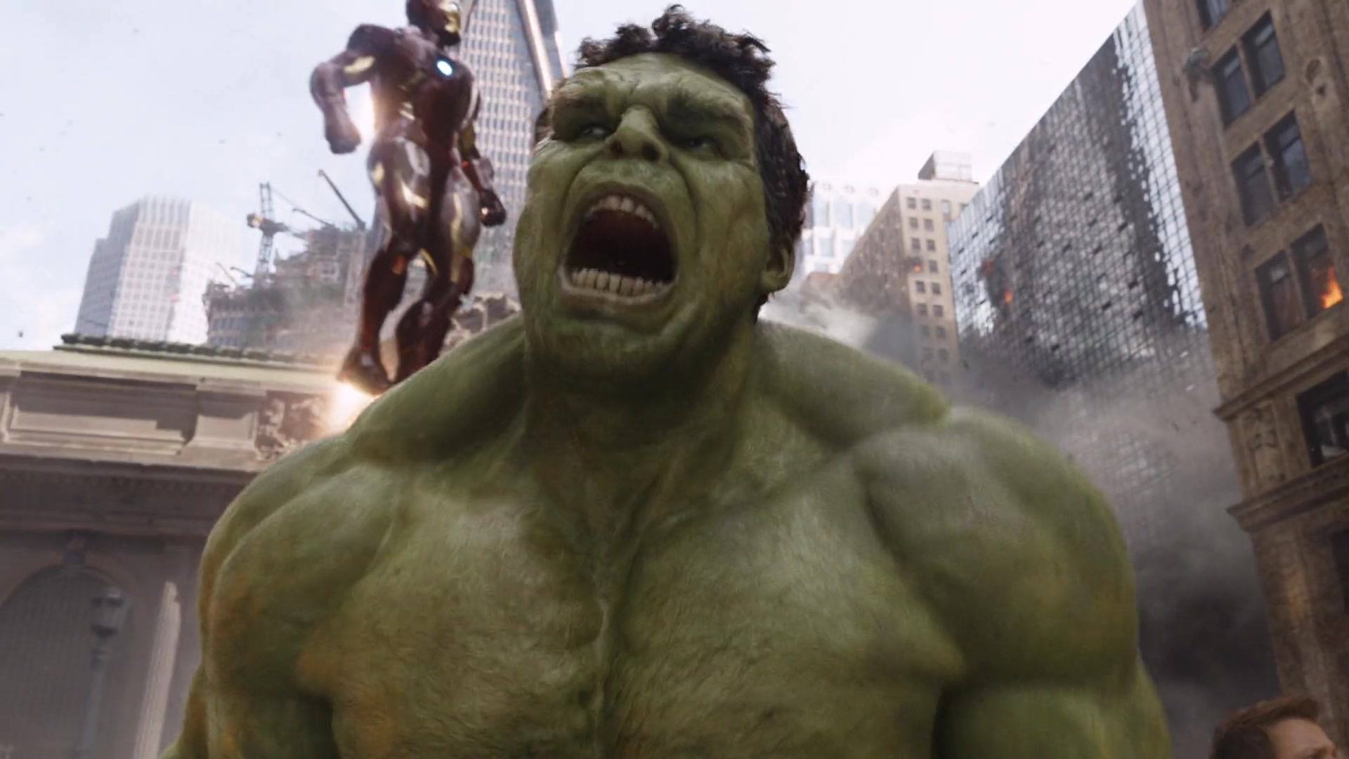 Hulk screams while Iron Man hovers above him in The Avengers