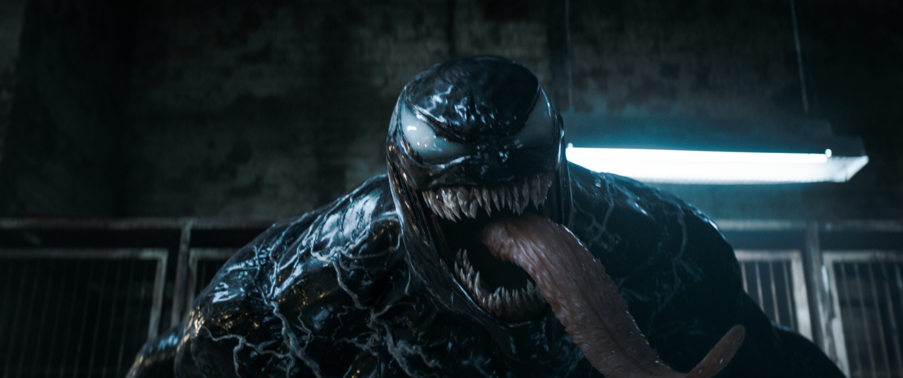 Venom smiling with a long tongue in Venom: The Last Dance.