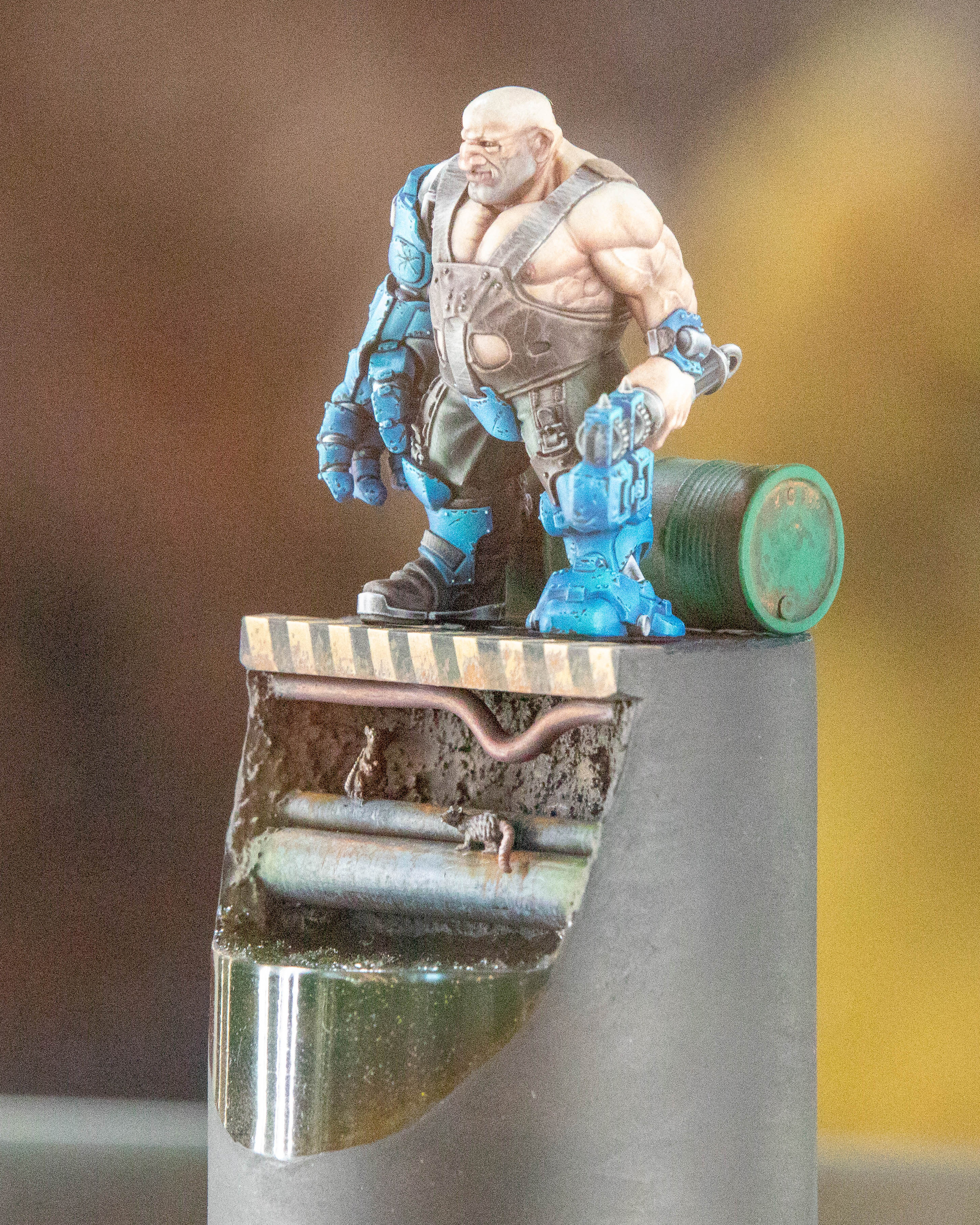 A model of a blue Ork on a pedestal