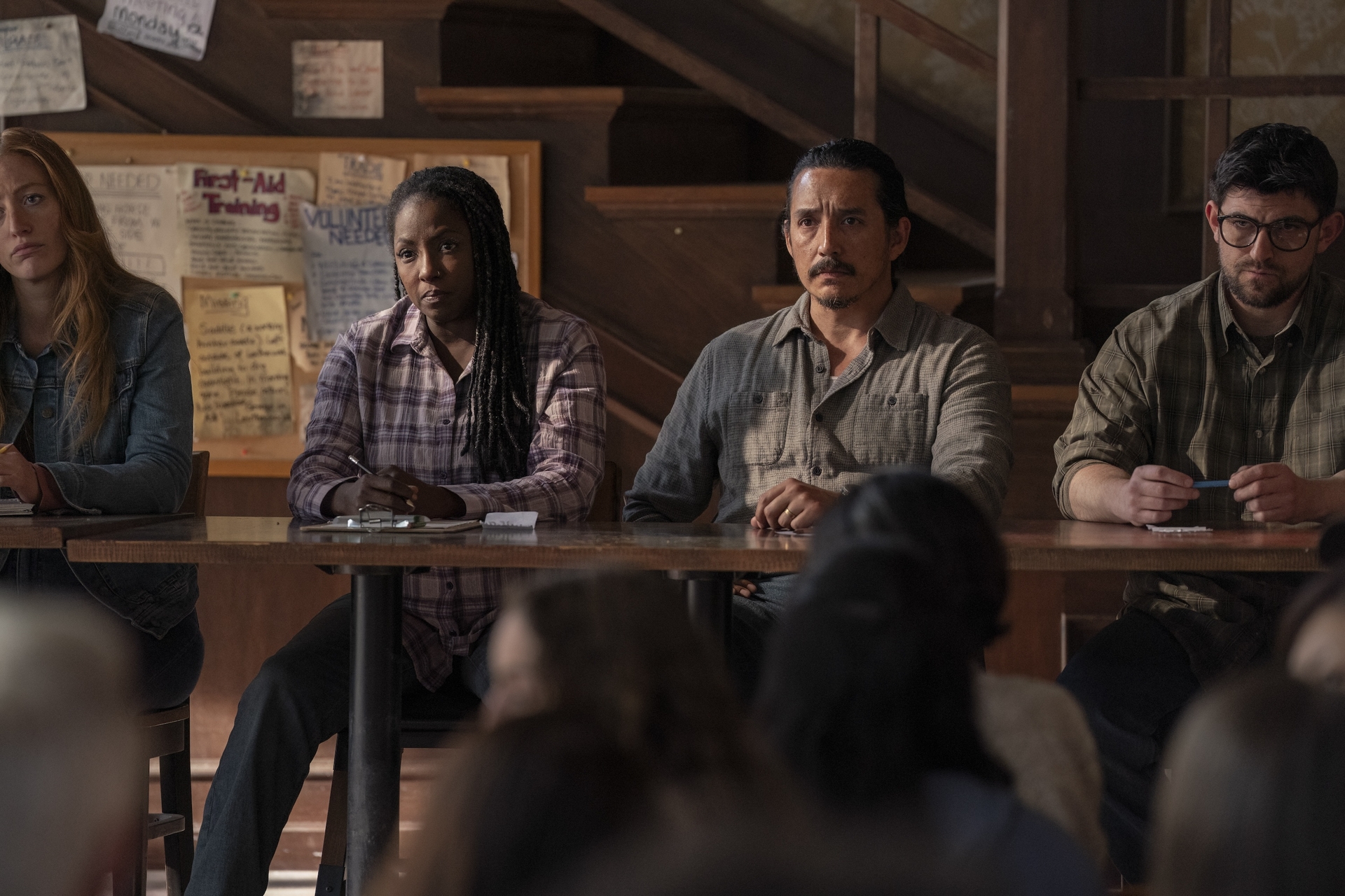 The Jackson council sitting and listening to Ellie in a still from TLOU season 2