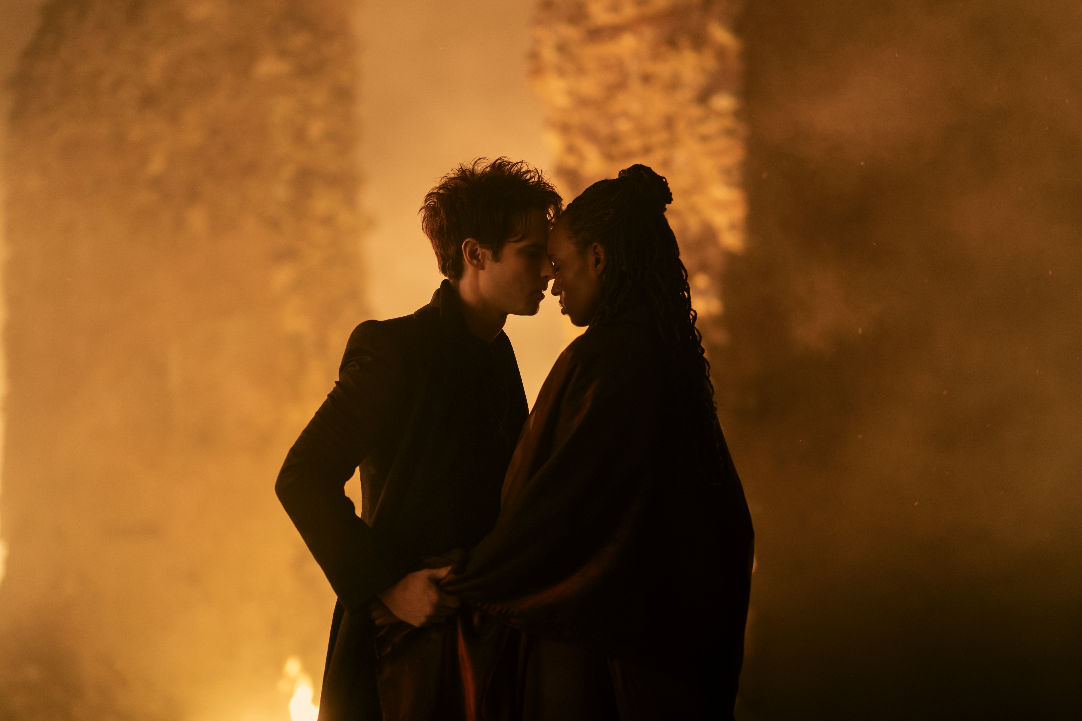 Tom Sturridge as Dream embraces Umulisa Gahiga as Nada in The Sandman