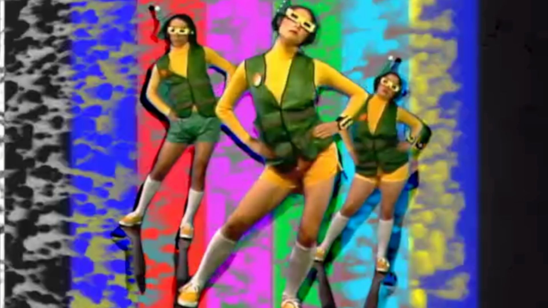A trio of dancers in 3D glasses against a staticky backdrop